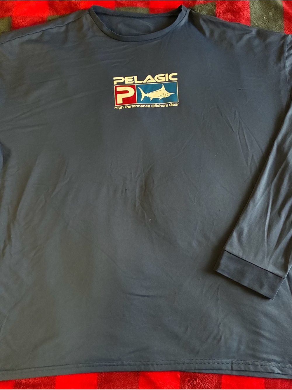 Pelagic Navy Long Sleeve Performance Shirt with Red & Blue Logo